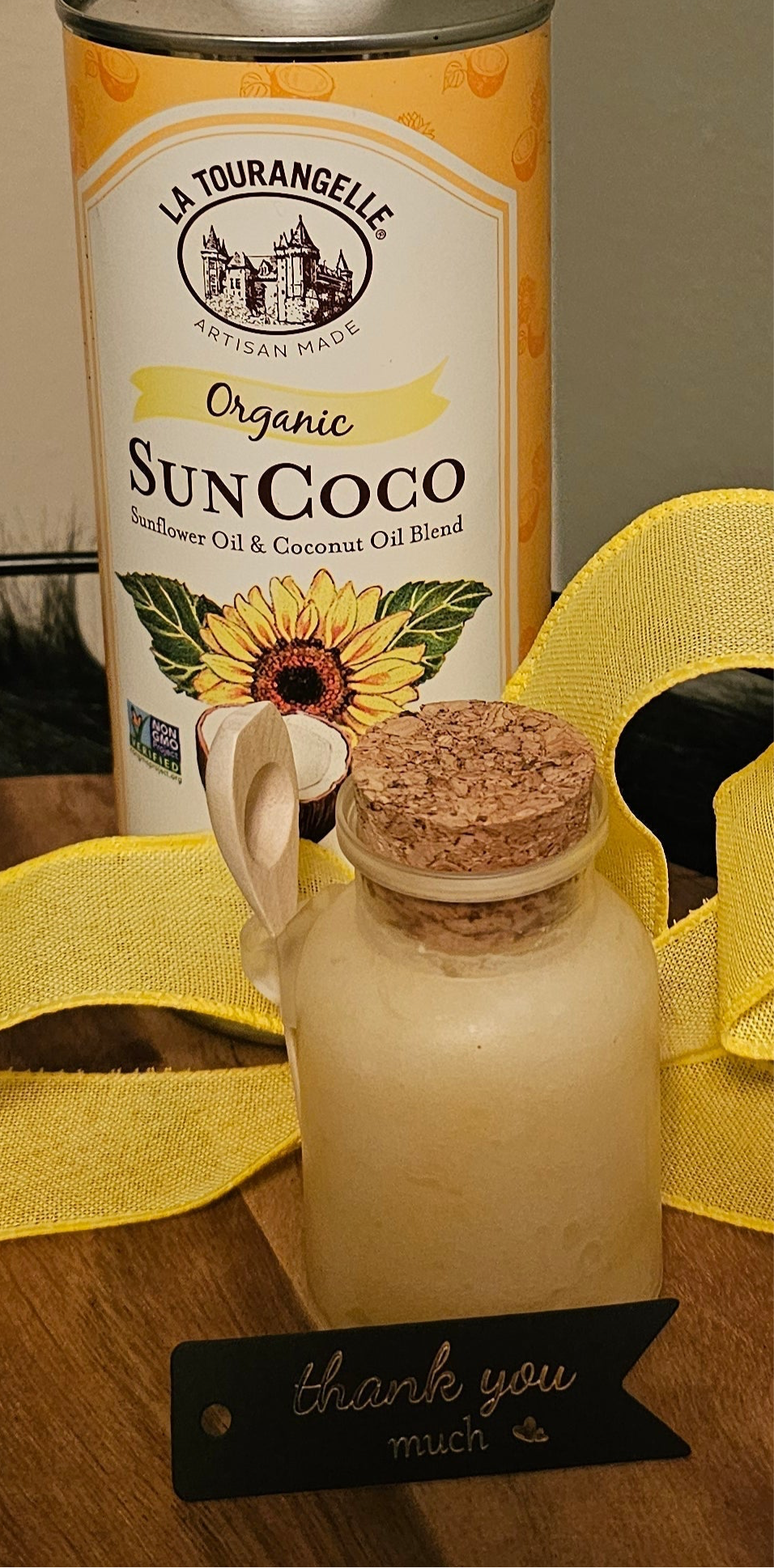 organic lemon sugar scrub in a cork top jar with wooden spoon